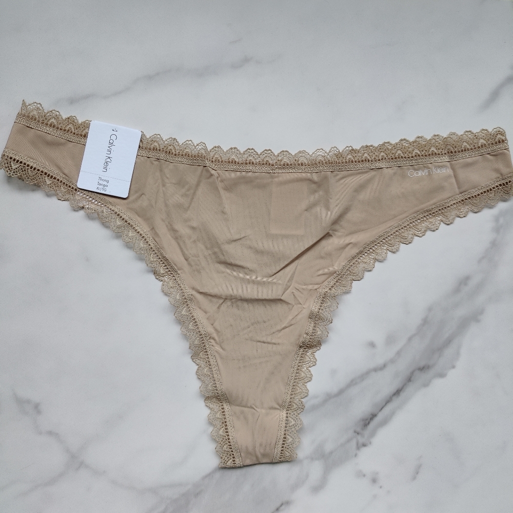 NWT CALVIN KLEIN FLIRTY MICRO THONG PANTY IN DESERT SIZE EXTRA LARGE